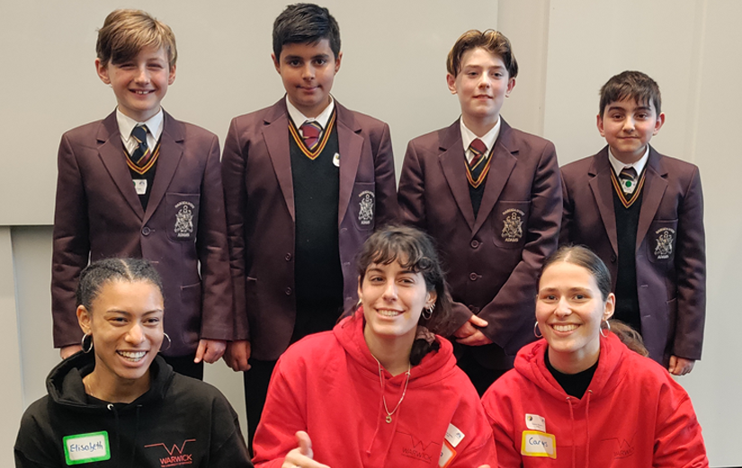 Students during an outreach event with school pupils