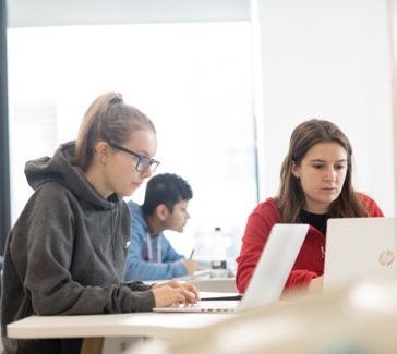 two students with computers