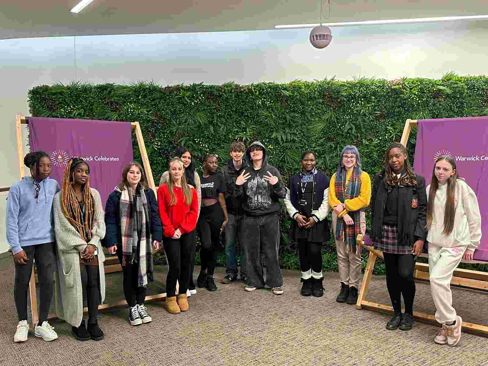 A photo of a posed group of young people