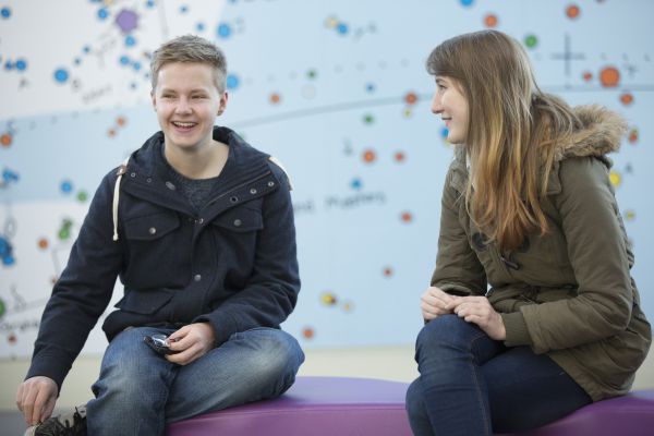 two students sitting in the Ramphal building